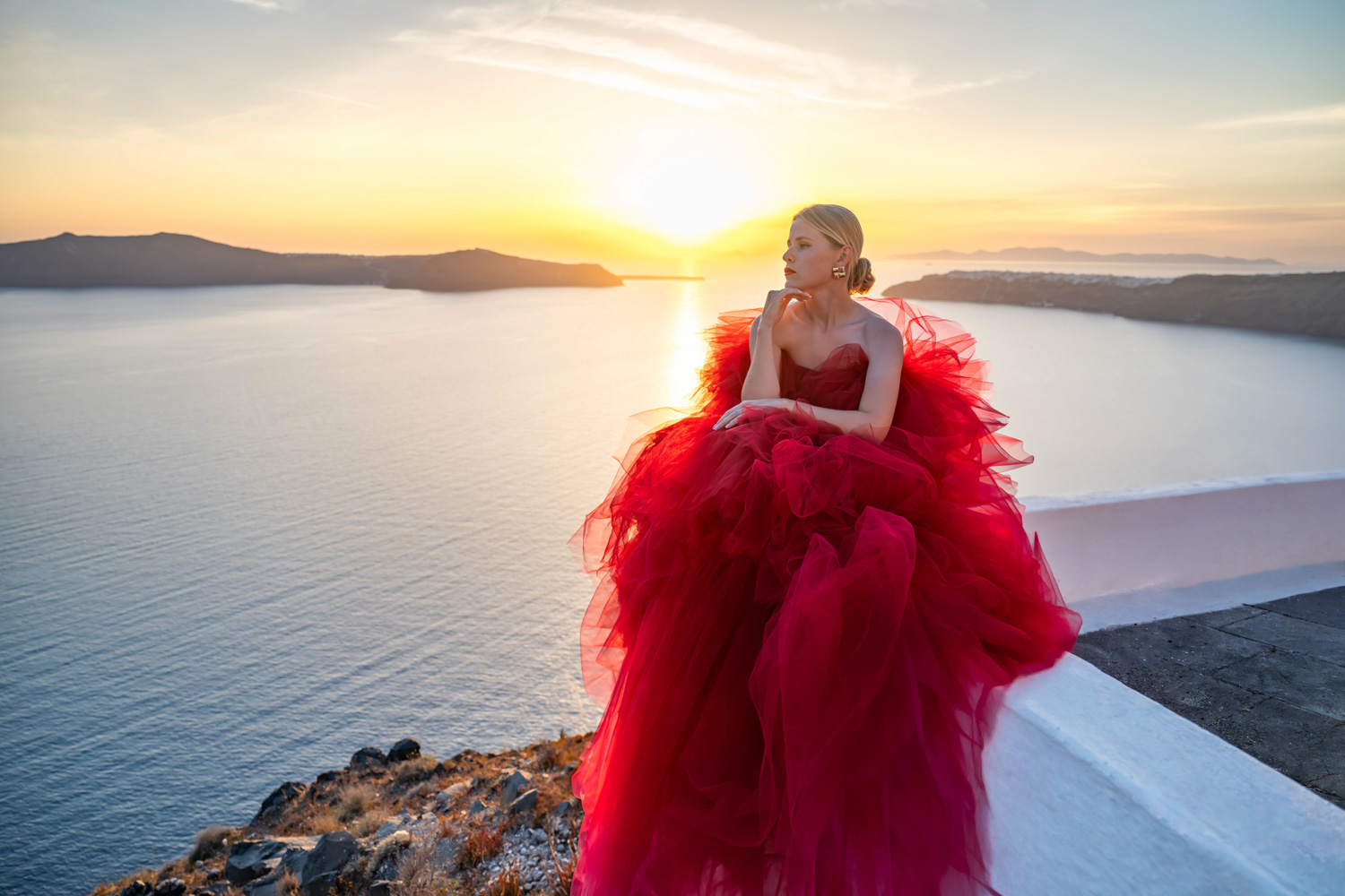 Couple enjoying the sunset during a Santorini photoshoot