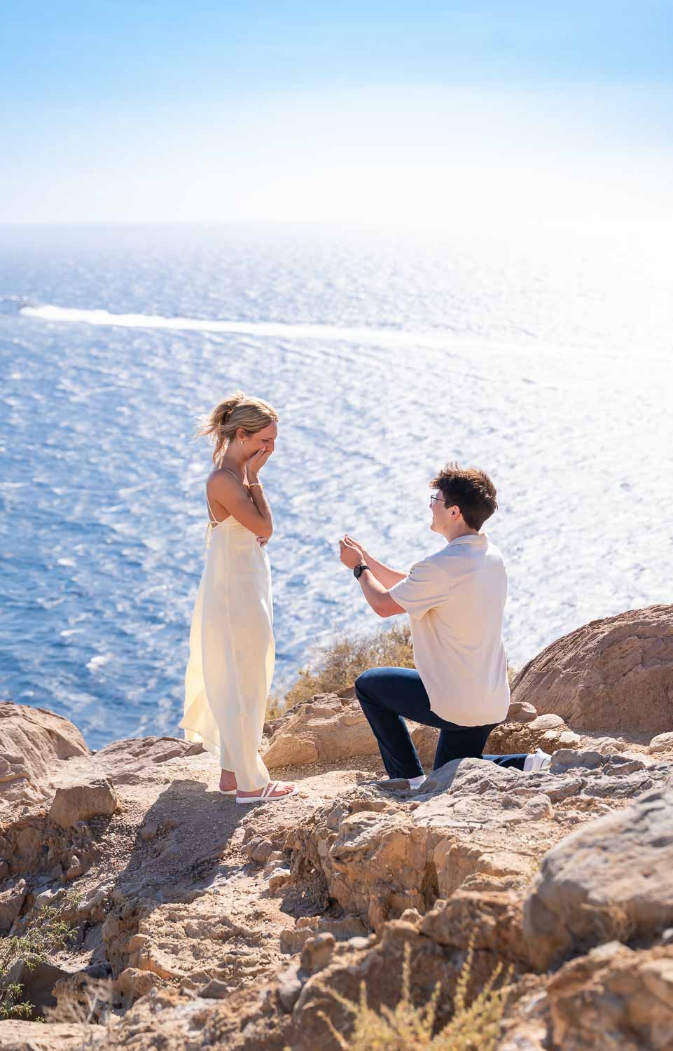 on the knee at santorini lighthouse