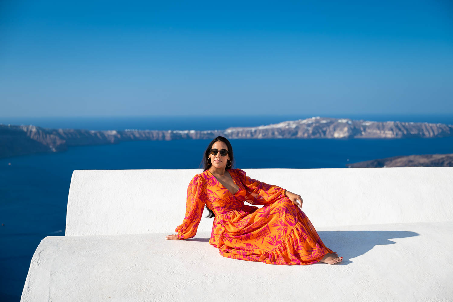 woman santorini blue dome